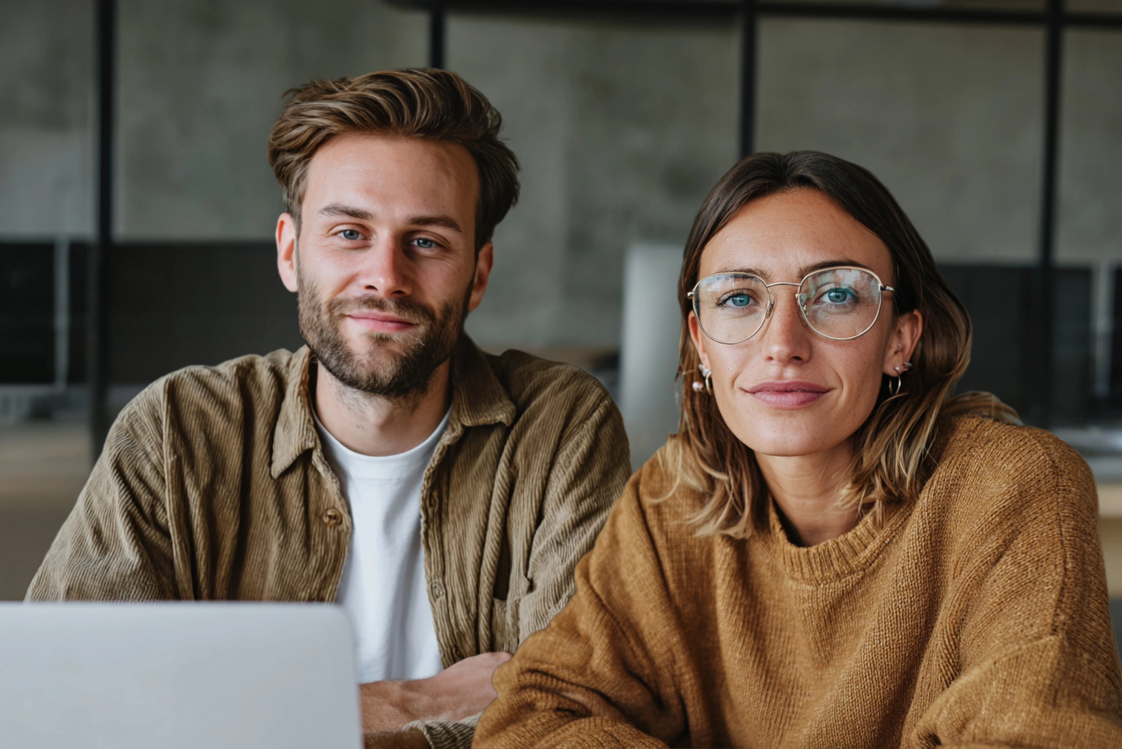Woman presenting a social media marketing strategy to a team in a modern meeting room.