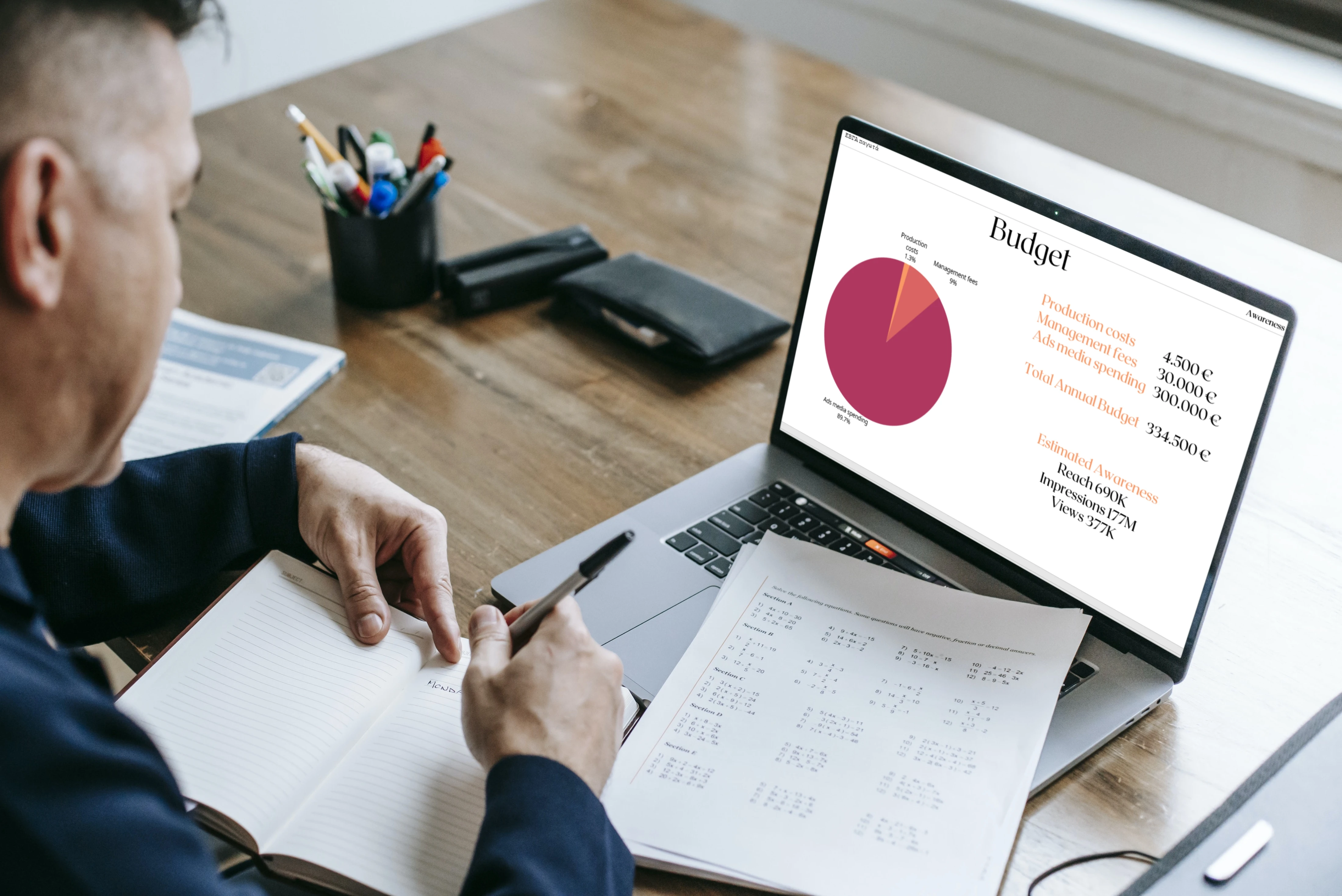 Professional reviewing a digital advertising budget and media plan on a laptop.