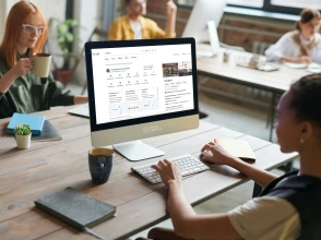 Team working on Google business profile optimization at a shared desk.